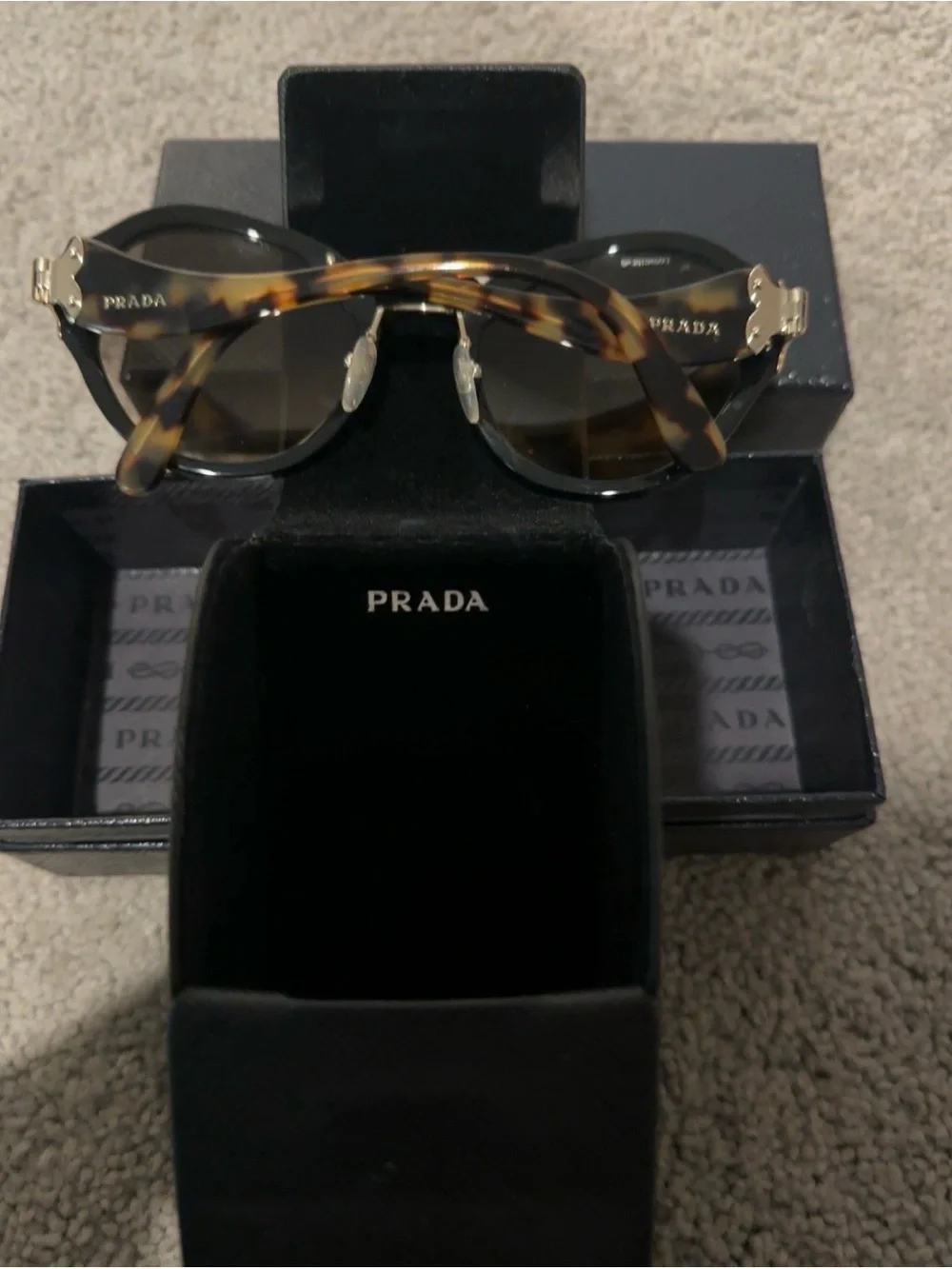 Prada Black Round Sunglasses with Brown-Tinted Lenses